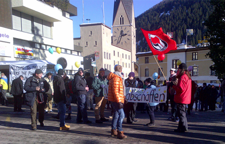 The World Economic Forum in Davos, Switzerland, an annual meeting of financial and political leaders from around the world, attracted a few hundred protesters this weekend. One of the signs said, “Welcome to the WEF where the politicians sell our future to the economy.” (Jerry Hagstrom/The Hagstrom Report)